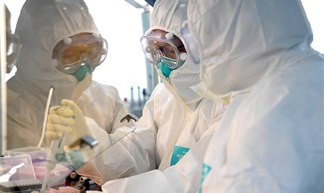 Researchers work at laboratory of disease prevention and control center in Nanyang