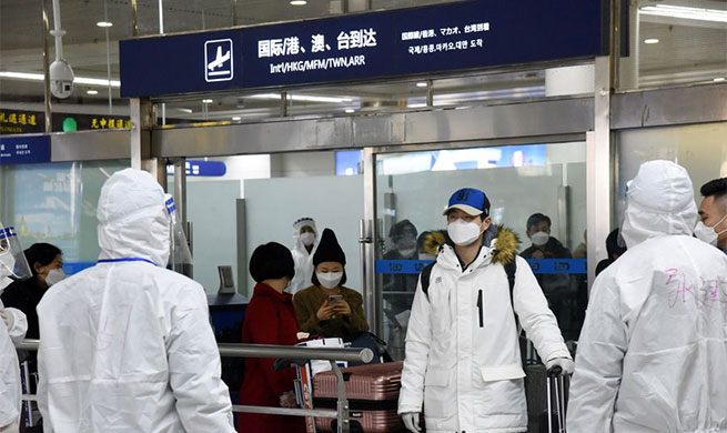 Xinhua Headlines: China fights novel coronavirus on two fronts