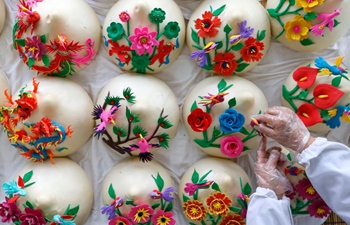 People across China make a variety of snacks during Lunar New Year